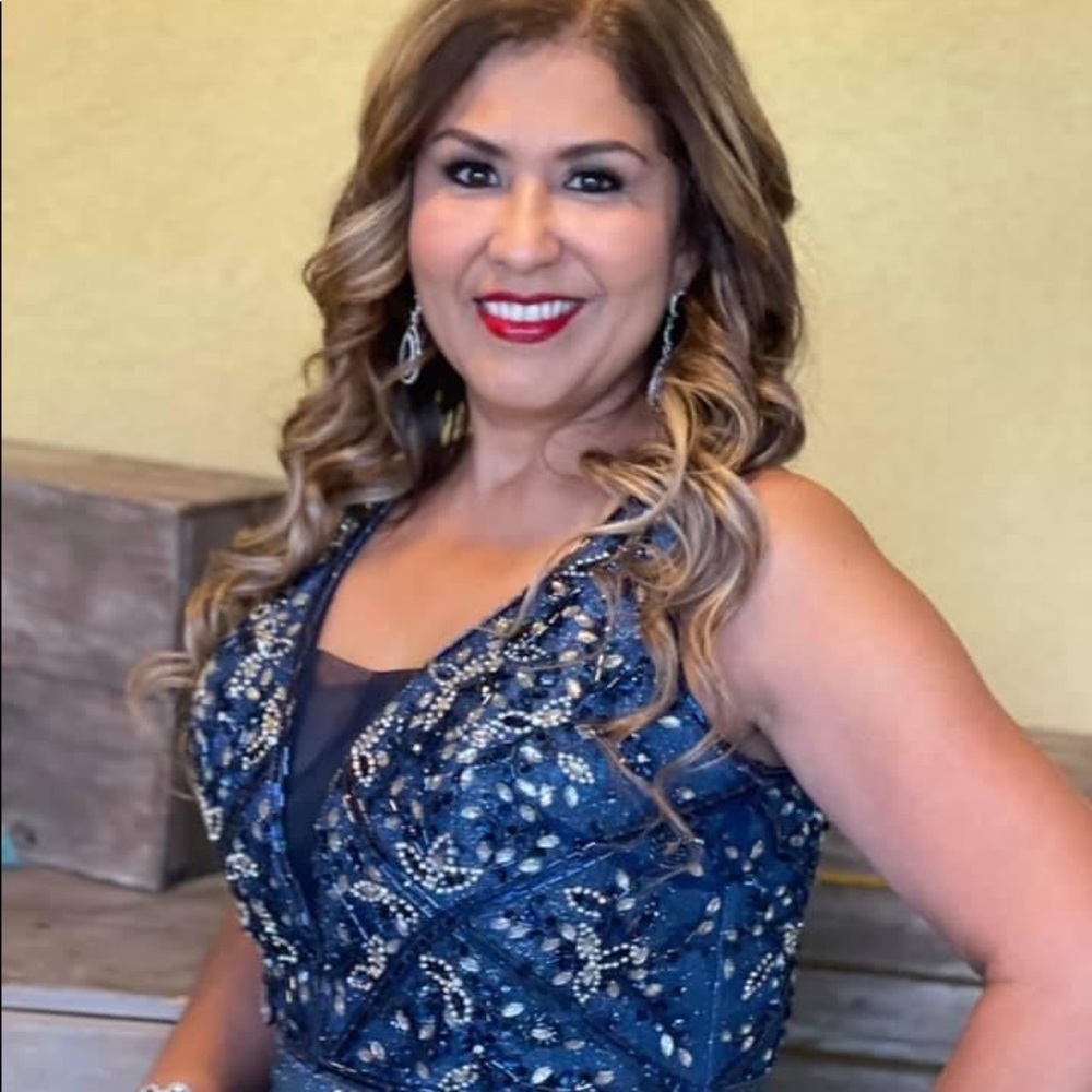 Fancy evening dress, especially for a wedding or important event.